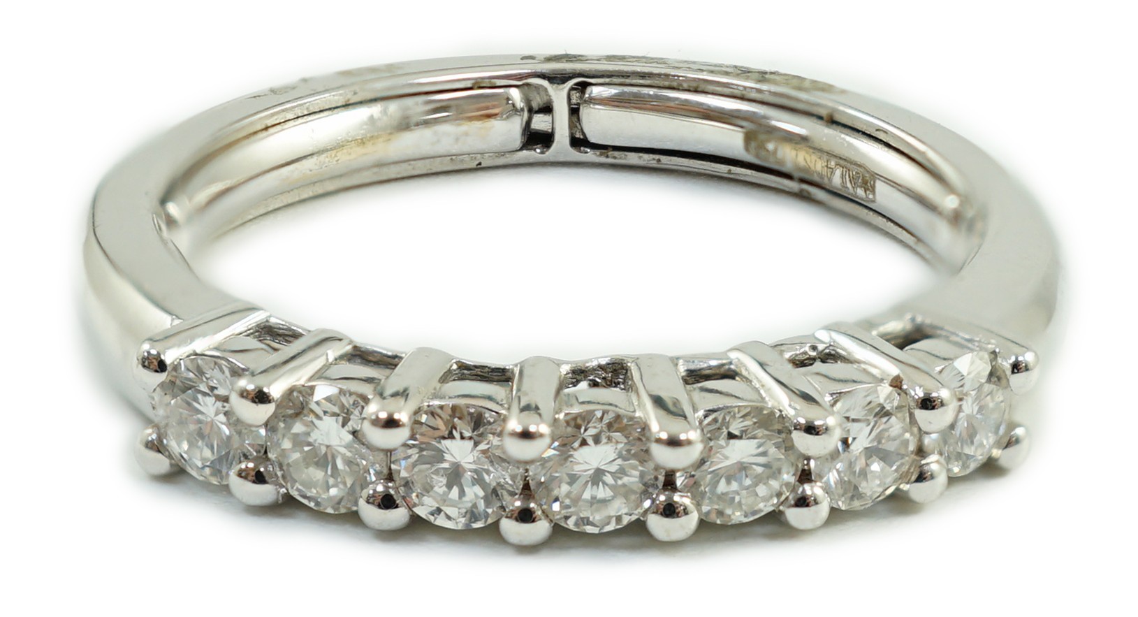 A modern Italian 18ct white gold and seven stone diamond set half hoop ring, size N, gross weight 3.9 grams.